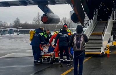 Russian rescuers carry a passenger wounded in the Azerbaijan Airlines plane crash from medical evacuation plane at Zhukovsky airport, outside Moscow, on Thursday. EPA