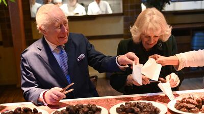 King Charles and Queen Camilla at Darjeeling Express. PA