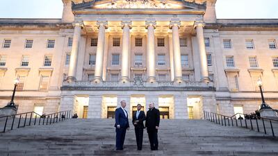 Mr Poots, Mr Sunak and Mr Heaton-Harris arrive at Parliament Buildings. AFP