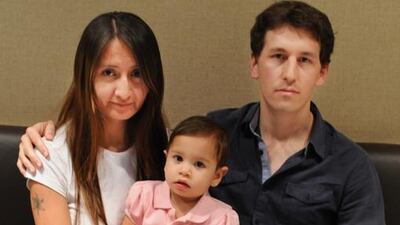 Aaron Faidley, his wife, Helen Rivera, and their daughter, Sofia, had to turn back around to Abu Dhabi after Ms Rivera was unable to transit through Frankfurt. Delores Johnson / The National