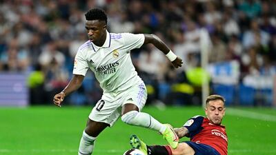 Osasuna defender Ruben Pena attempts to tackle Vinicius Junior. AFP