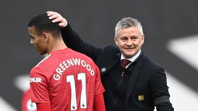 United manager Ole Gunnar Solskjaer congratulates Mason Greenwood after the match. Reuters