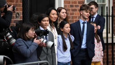 Lucia Hunt, wife of Mr Hunt, with their children as he leaves 11 Downing Street. AFP