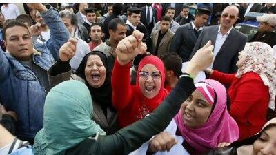 Employees of the public health sector shout slogans as they rally in Cairo yesterday to demand better wages and working conditions.