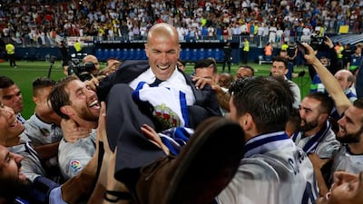 Zinedine Zidane, manager of Real Madrid, celebrates with his players after being crowned champions of Spain. Gonzalo Arroyo Moreno / Getty Images