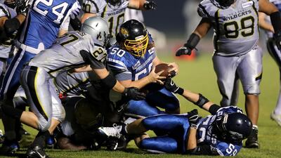 Dubai Barracudas player Alexander Rodriguez goes over for a touchdown during the Desert Bowl. Chris Whiteoak / The National
