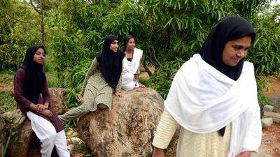 Sainabaya Alukkal Mohammed, right, Principal and Wife of Mr P.T. Mohammed Hussain, who founded the Salsabeel Green School with the students at her school. Credit: Ronny Sen for The National