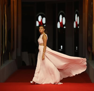 Egyptian actress Bushra Roza poses on the red carpet during the third edition of El Gouna Film Festival (GFF). AFP