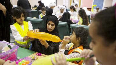 Mariam Al Zaabi participates in the Curiosity Machine programme with daughters Sheikha, left , and Reem. Christopher Pike / The National