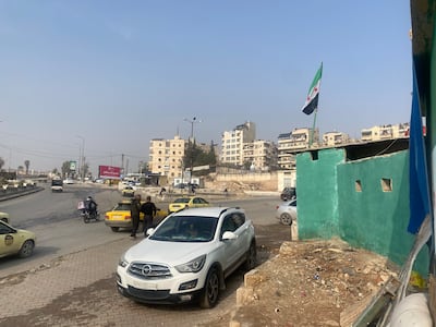 A joint checkpoint between Syrian security forces and Kurdish militias on the outskirts of Aleppo's Ashrafieh district on December 10. Lizzie Porter / The National