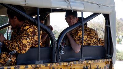 Armed militiamen of the Houthi movement ride a vehicle as they patrol at a street in Sanaa Yemen. EPA