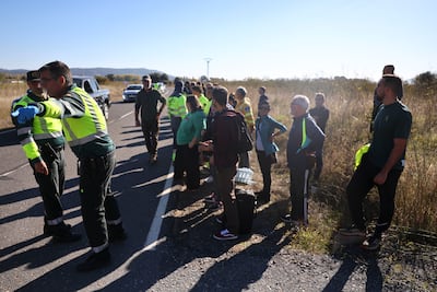 Rescuers arrive at the scene in the village of Urda. EPA