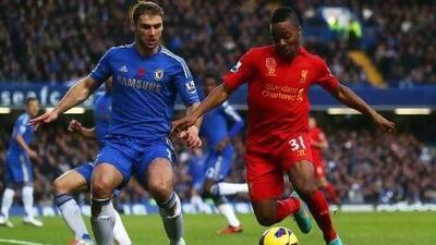 Raheem Sterling, right, the 17-year-old winger, has firmly established himself in the Liverpool starting line-up this season. Clive Rose / Getty Images