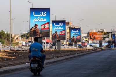 Banners installed by the Lebanese military in southern Beirut. The army is tasked with bringing all weapons under government control. AFP