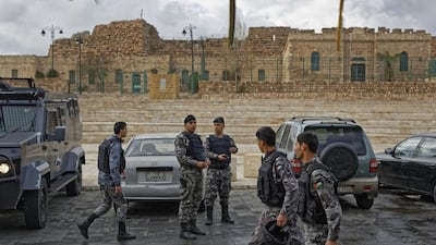 Jordanian security forces stand guard outside Karak castle. Ben Curtis / AP Photo