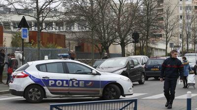 French police at the scene of the nursery school in Aubervilliers, near Paris, where a teacher claimed to have been attacked by a masked man invoking ISIL. Charles Platiau / Reuters