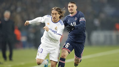 Real Madrid's Luka Modric outpaces PSG’s Marco Verratti. EPA