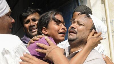 The sister of an Indian girl who was raped and set on fire cries out during her funeral in Greater Noida near New Delhi on March 9, 2016. AFP