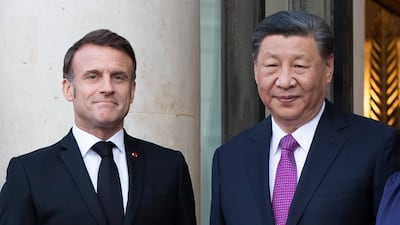 Mr Macron and Mr Xi Jinping in Paris on Monday. EPA
