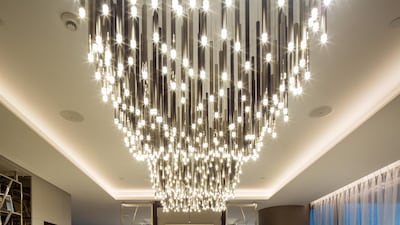 A lot of the furniture in One Palm's show apartment is bespoke. A magnificent chandelier that runs across the length of the living spaces and unifies them was designed by Elicyon. Antonie Robertson/The National