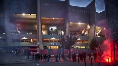 French riot police stand in clouds of tear gas outside the Parc des Princes. Getty