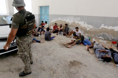 Rescued migrants in the port of Ben Gardane, south Tunisia. AP