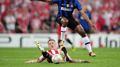 Inter's Samuel Eto'o is challenged by Bastian Schweinsteiger of Bayern. Getty