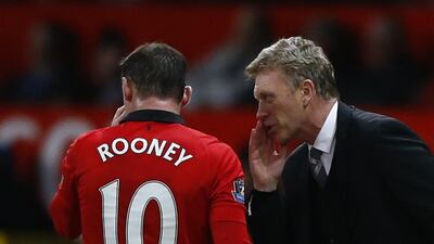 Wayne Rooney, left, was unhappy at Old Trafford last season but the striker is now settled once again, and he hands much of the credit for that to Manchester United manager David Moyes. REUTERS/Darren Staples