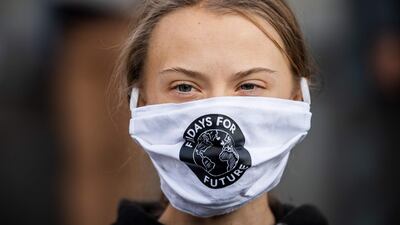Swedish climate activist Greta Thunberg (C) takes part in a Fridays For Future protest in front of the Swedish Parliament (Riksdagen) in Stockholm on September 25, 2020. Fridays for Future school strike movement called for a global day of climate action on September 25, 2020 AFP