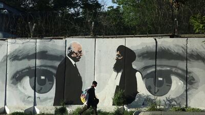 A graffiti depicts Washington's peace envoy Zalmay Khalilzad, left, and Mullah Abdul Ghani Baradar, the leader of the Taliban delegation, in Kabul. Is the Taliban that the US made peace with last year different from the Taliban of the past? AP Photo