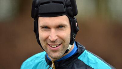 Arsenal's Czech goalkeeper Petr Cech is pictured as he takes part in a training session ahead of the UEFA Champions League round of 16 1st leg football match against Barcelona at Arsenal's London Colney training ground on February 22, 2016. Arsenal will play against Barcelona at the Emirates Stadium in London on Tuesday February 23, 2016. / AFP / GLYN KIRK