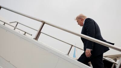 US President Donald Trump boards Air Force One as he departs from Beijing on Friday. Reuters