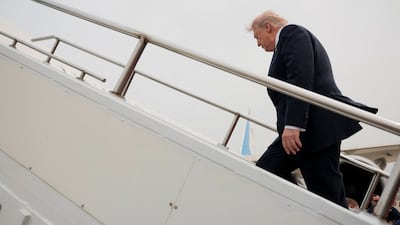 US President Donald Trump boards Air Force One as he departs from Beijing, China, on Friday. Reuters