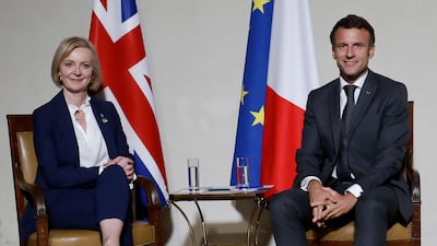 French President Emmanuel Macron and Britain's Prime Minister Liz Truss meet during the European Political Community Summit in Prague, the Czech Republic, on Thursday. AFP