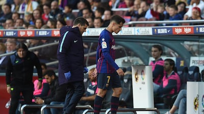 Philippe Coutinho of FC Barcelona leaves the pitch injured. Getty Images