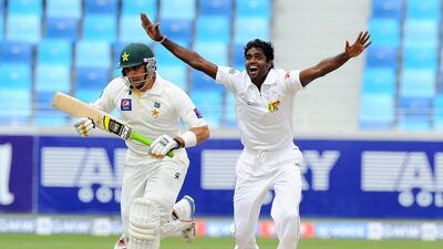 Sri Lankan bowler Shaminda Eranga, right, unsuccessfully appeals for a Leg Before Wicket (LBW) decision against Pakistan batsman Misbah-ul-Haq during the fourth day of the second cricket Test match between Pakistan and Sri Lanka at the Dubai International Cricket Stadium on Saturday. AFP PHOTO/Ishara S. KODIKARA