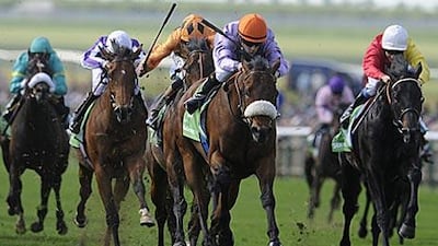 Makfi is guided to a surprise win by Christophe Lemaire, in the orange cap, at Newmarket racecourse yesterday.