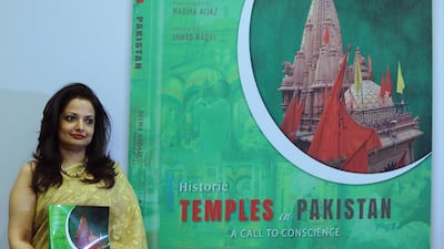 The Pakistani author Reema Abbasi at the launch of her book Historic Temples in Pakistan. Abbasi's book aims to highlight the importance of the country's historic buildings and the different religious faiths they were built to represent. Sajjad Hussain / AFP