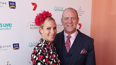 Zara Tindall, wearing a black, white and red poppy print dress and a clutch by Kate Spade, and Mike Tindall attend the Magic Millions Raceday at the Gold Coast Turf Club on January 12, 2019. Getty Images