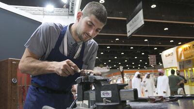 Oliver Leclercq, 25, a gunmaker at Rigby of London. Mona Al Marzooqi / The National