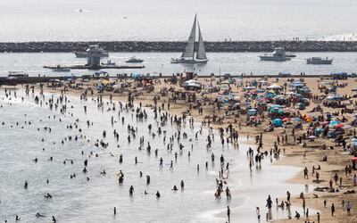 Visitors crowd the beach during the Memorial Day holiday weekend as Southern California sees a relaxing of restrictions that were in place to due to the coronavirus pandemic, in Newport Beach, California, USA. EPA