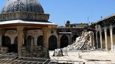 The rubble of a minaret destroyed in fighting in April fills a corner of the courtyard of the Umayyad mosque in Aleppo's Old City. Jalal Al Halabi / AFP