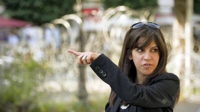 Famous Tunisian blogger Lina Ben Mhenni is seen on Bourguiba avenue in tunis on October 20, 2011, days before a historic national election in Tunisia. Arab states that were once transfixed by the January revolt in Tunisia are now more focused on their internal crises than the historic October 23 elections in the tiny north African state. Tunisians are to elect members of an assembly that will write a new constitution for the country, nine months after strongman Zine el Abidine Ben Ali was ousted in protests that spread to countries across the region. AFP PHOTO / LIONEL BONAVENTURE (Photo by Lionel BONAVENTURE / AFP)