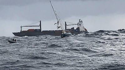 A New South Wales Police vessel approaches the stricken yacht to rescue an Irish and a French national some 400kms of the New South Wales coast. AFP
