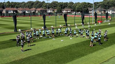 All Liverpool players and coaching staff sing Happy Birthday to Gerrard during a training session at Melwood. Getty