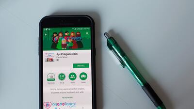 The option to download the AyoPoligami dating app is seen on a phone in Jakarta on September 14, 2017. Beawiharta / Illustration / Reuters
