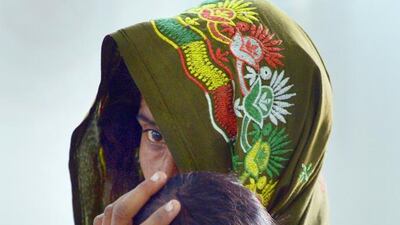 A mother with her starving baby at a government hospital in Mithi, the capital of Tharparkar district in Pakistan, this week. At least 62 children have died and thousands are suffering from the effects of malnutrition. Rizwan Tabassum / AFP