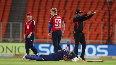 India's Rishabh Pant lies on the ground after being run out for 25. AP