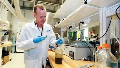 Dr. Jens Ejbye Schmidt, professor in Biofuels in the Chemical Engineering program at Masdar Institute, demonstrates how to convert organic waste into fuel in a campus laboratory in Abu Dhabi. Sarah Dea/The National