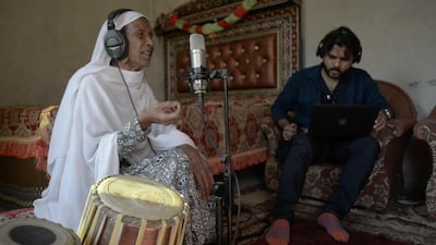 Zohaib Kazi records a track with Zarsanga, far left, a Pathan singer, in Nowshera in northern Pakistan Photo Insiya Syed